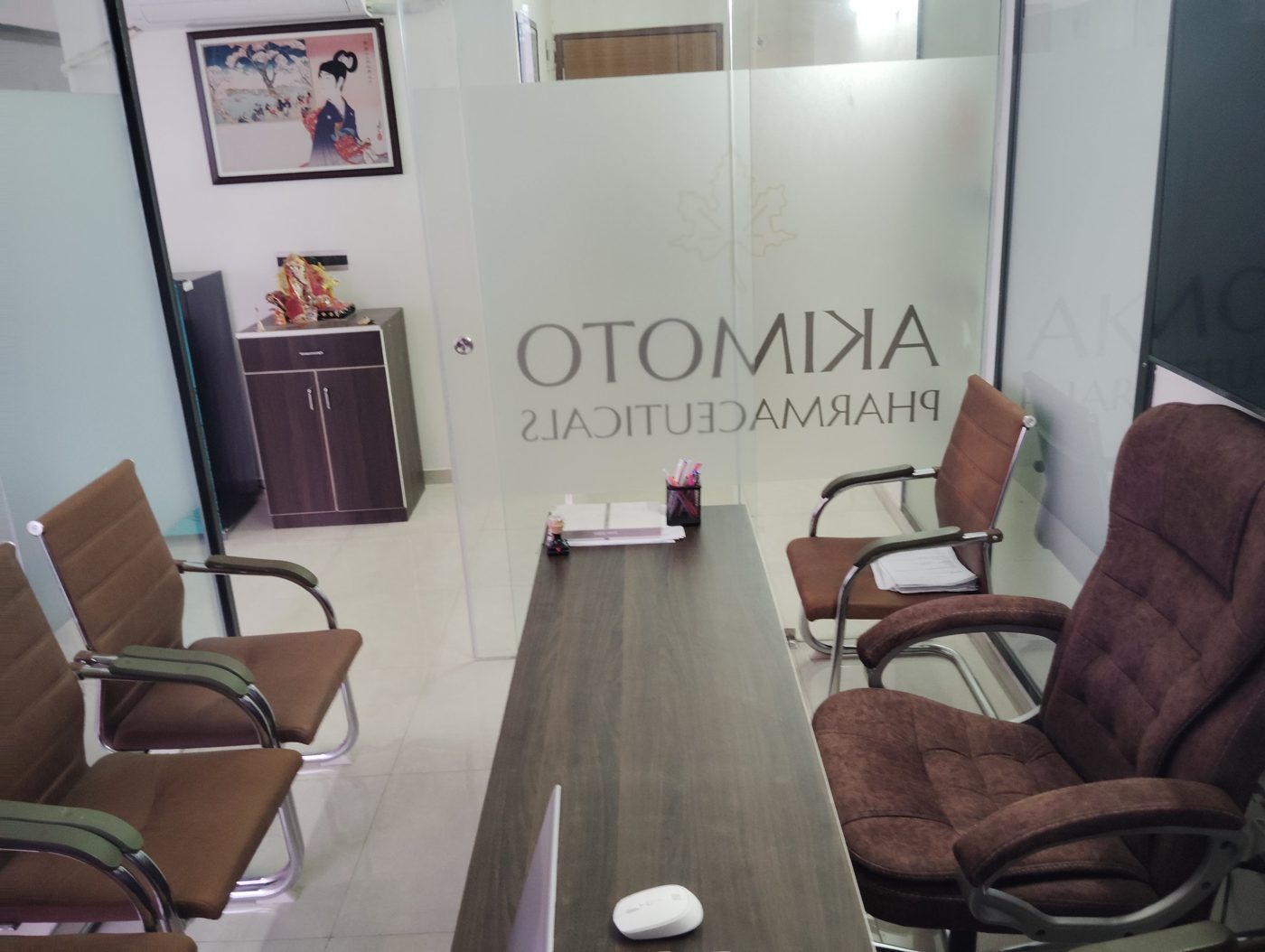 Meeting table and chairs inside the Akimoto Pharmaceuticals office in Lucknow